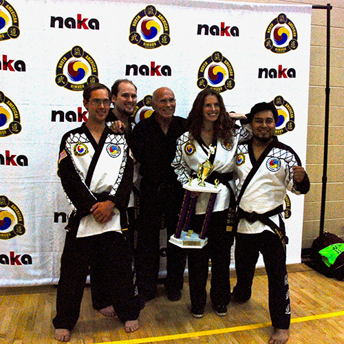 Our black belts celebrate a big win at tournament together!